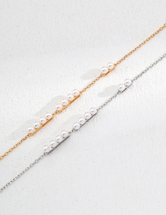 Gilded Pearl Triskele Necklace